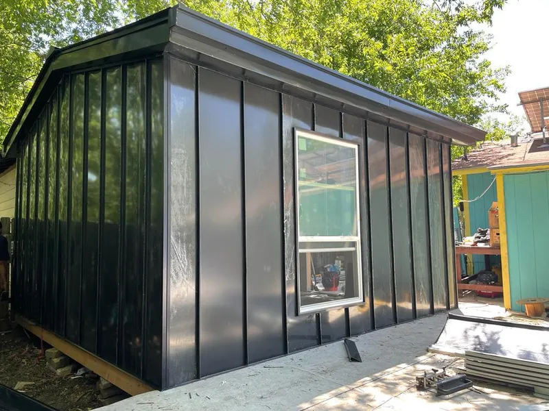 Black standing seam metal wall panels for Roof Inspection in Millington