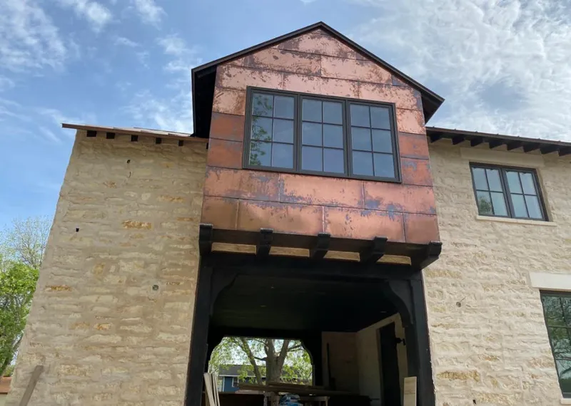 Copper metal panel facade on a stone building for Metal Roof Coating in Millington